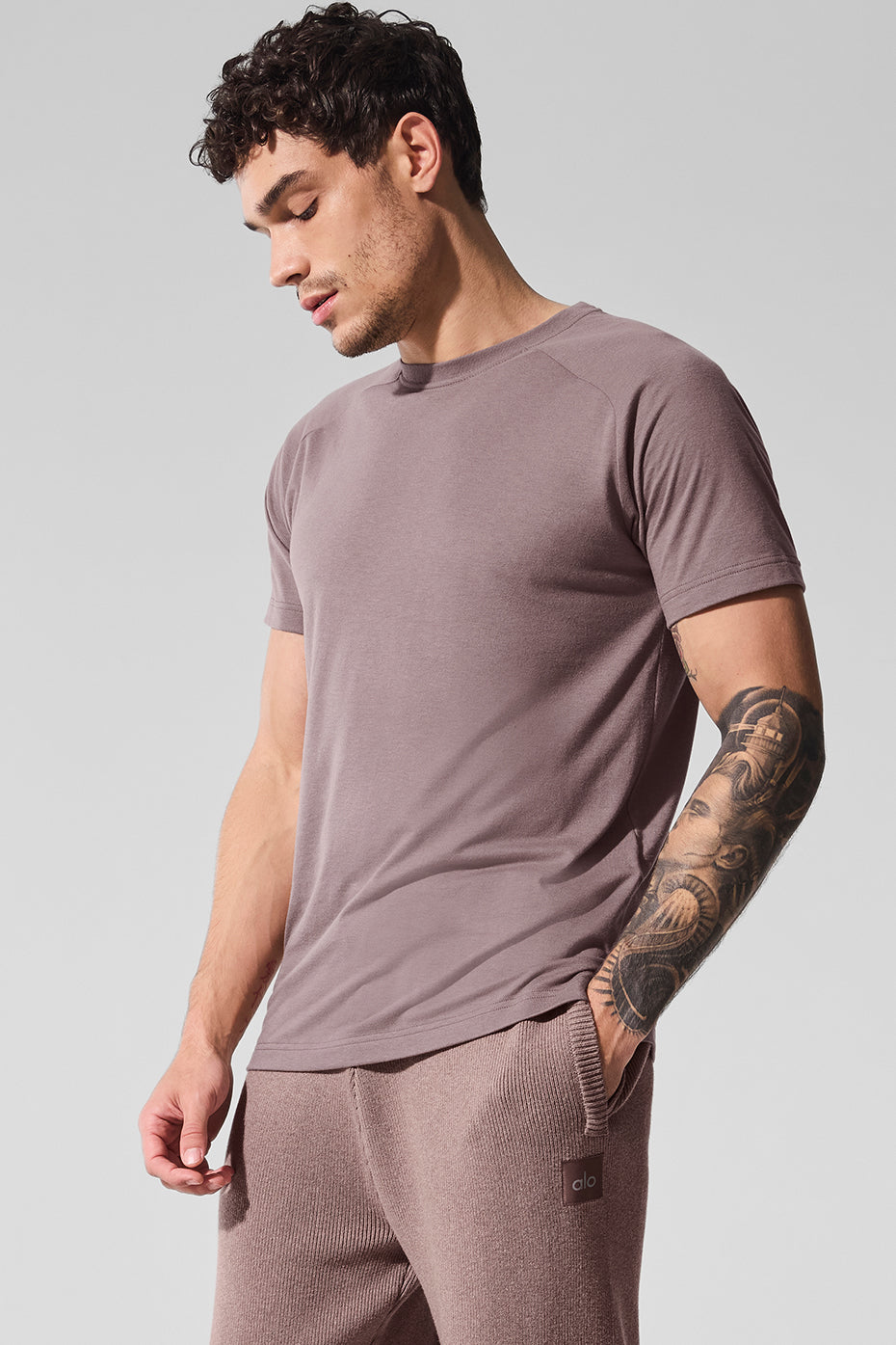 Triumph Raglan Tee in mushroom color, showcasing the crew neck design.