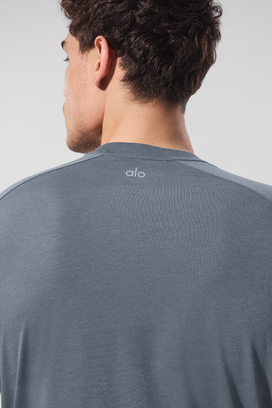 Back view of the Triumph Raglan Tee, demonstrating its unique fit and style.