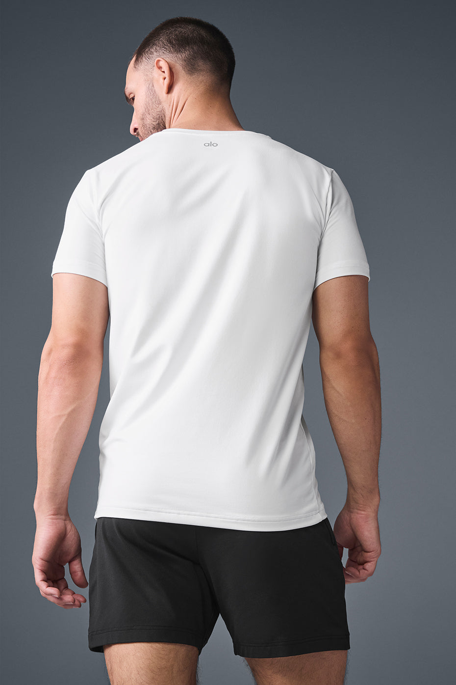 Laid-back display of crewneck t-shirt on wooden bench, ideal for layering.