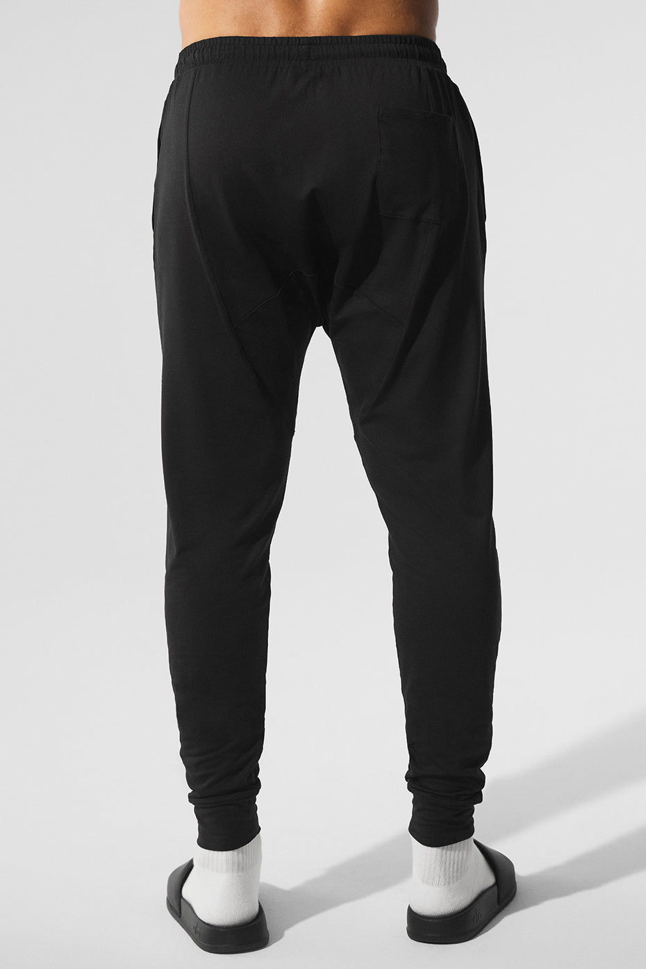 Model wearing black Revitalize workout leggings during yoga class.