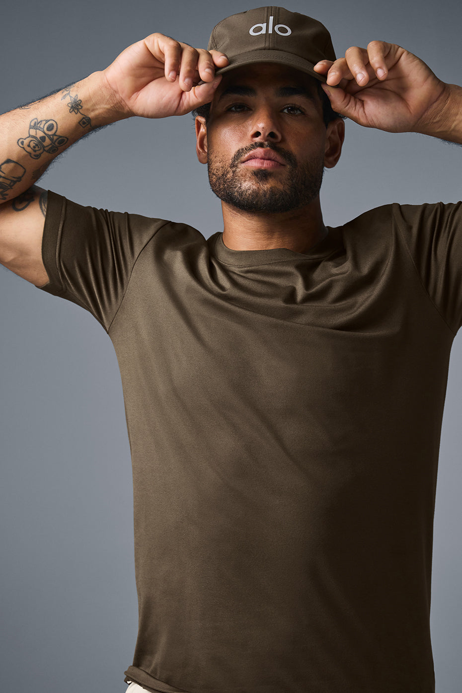 Close-up of fabric texture on mens athletic shirt in espresso color