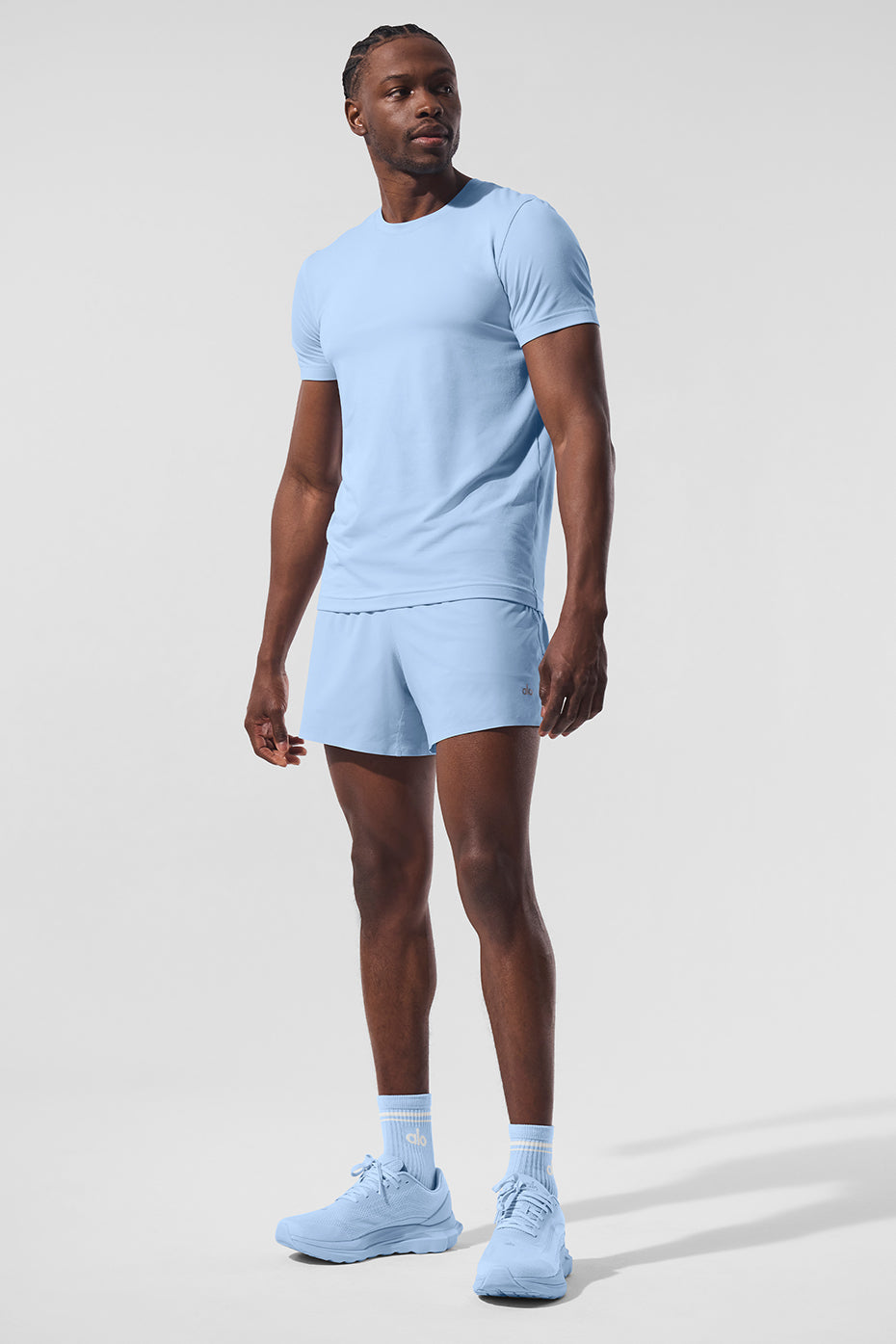 Side view of the Conquer Reform crewneck t-shirt in Seashell Blue.