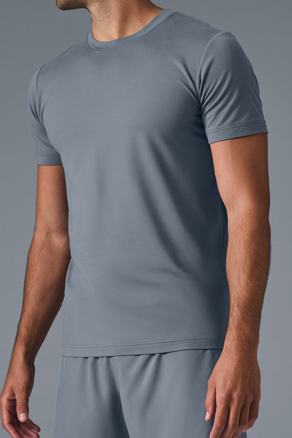 Model wearing the crewneck sweatshirt with short sleeve dress shirts for a stylish look.