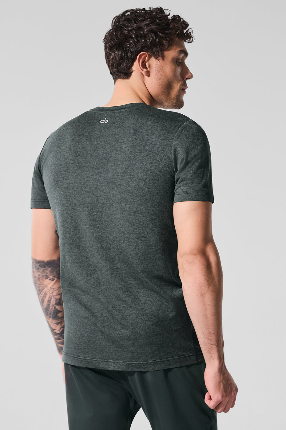 Model wearing Elevate Crewneck Fitness T-Shirt during a workout.