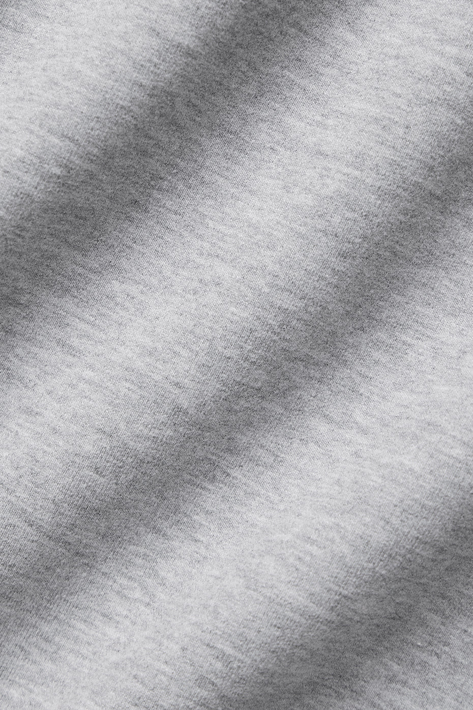 Side view showcasing the extended sleeves of the oversized t-shirt.
