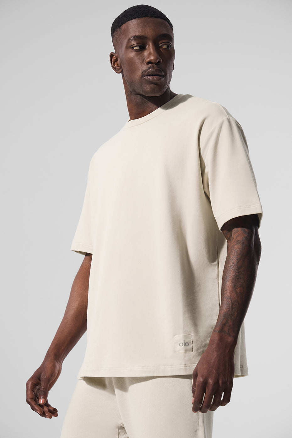 Front view of the oversized men's T shirt in bone white, ideal for casual summer style