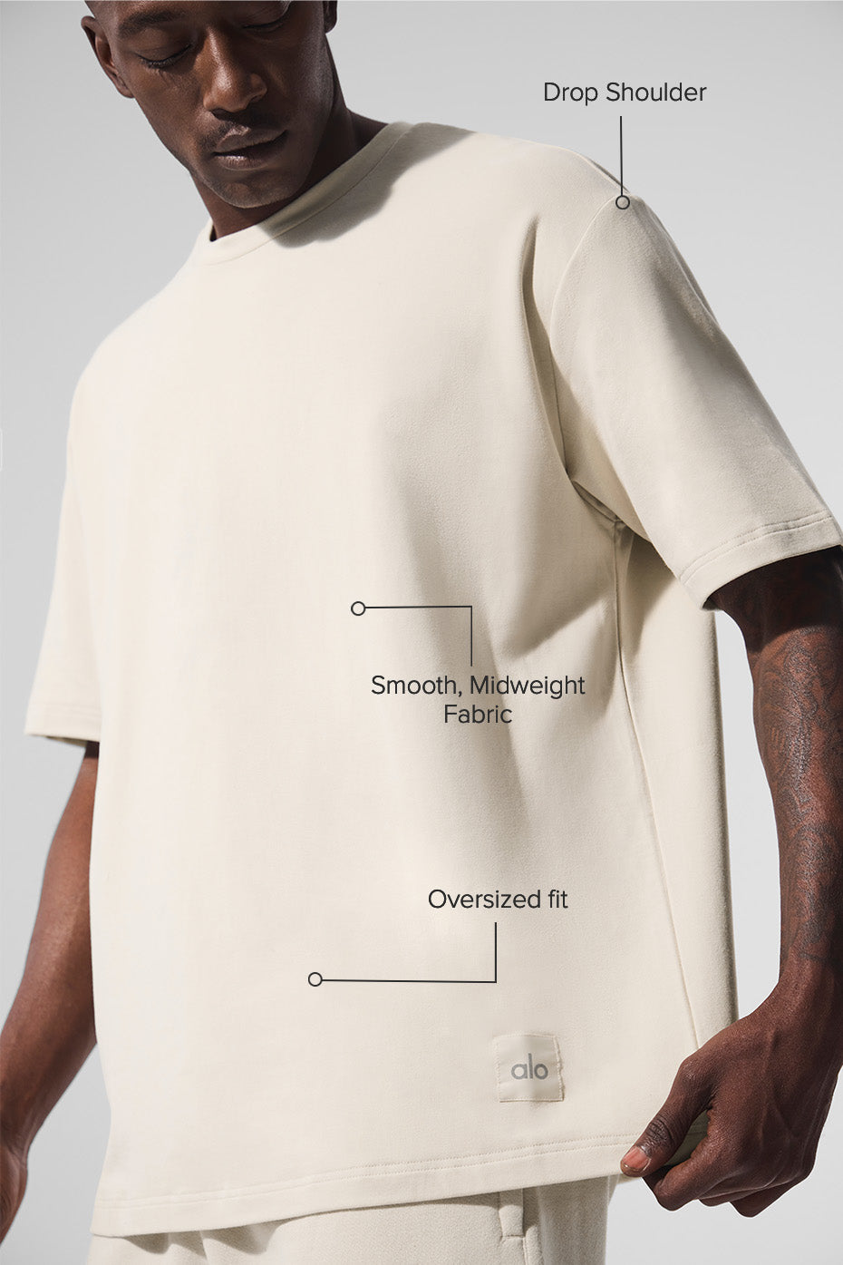 Detail shot of the extended sleeves and hem on the mens short sleeve T shirt