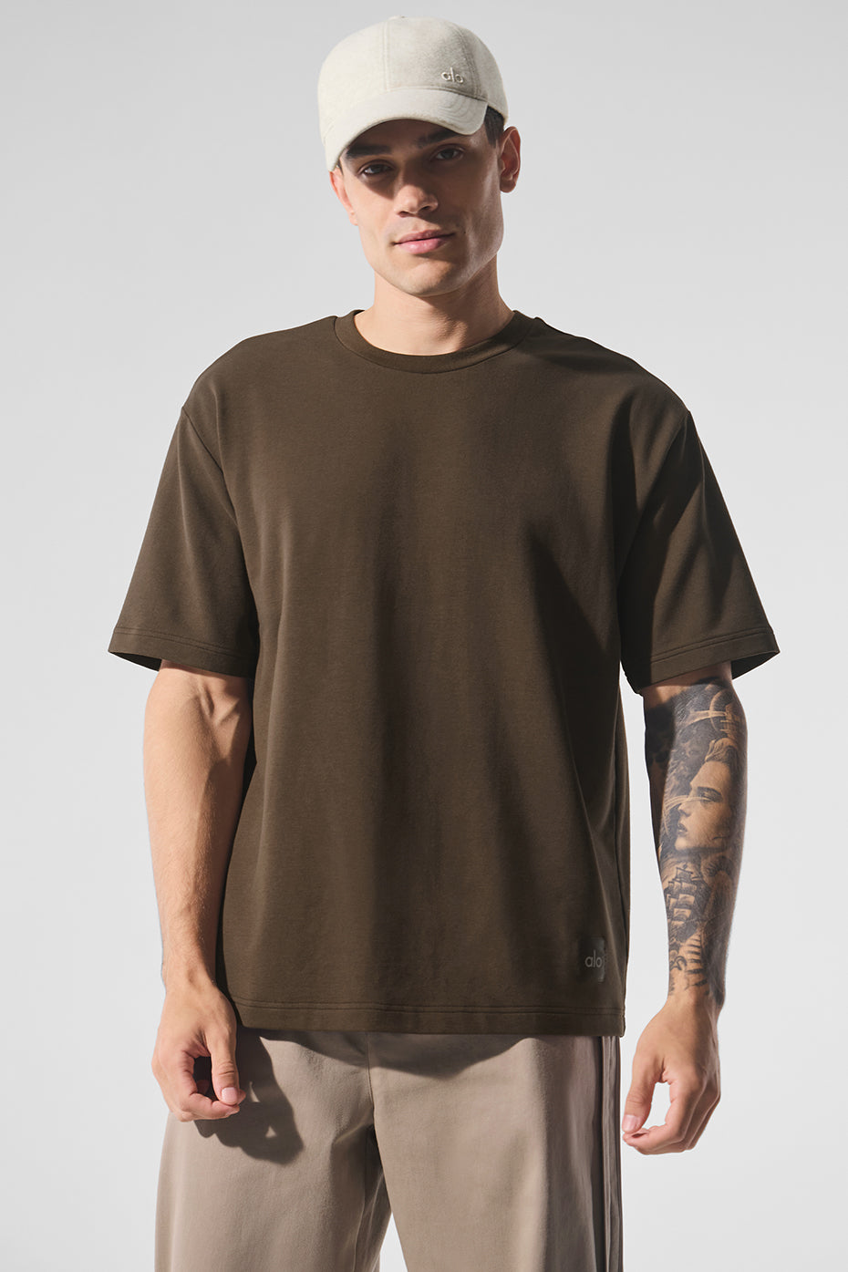 Front view of Espresso oversized t-shirt styled with cargo pants.