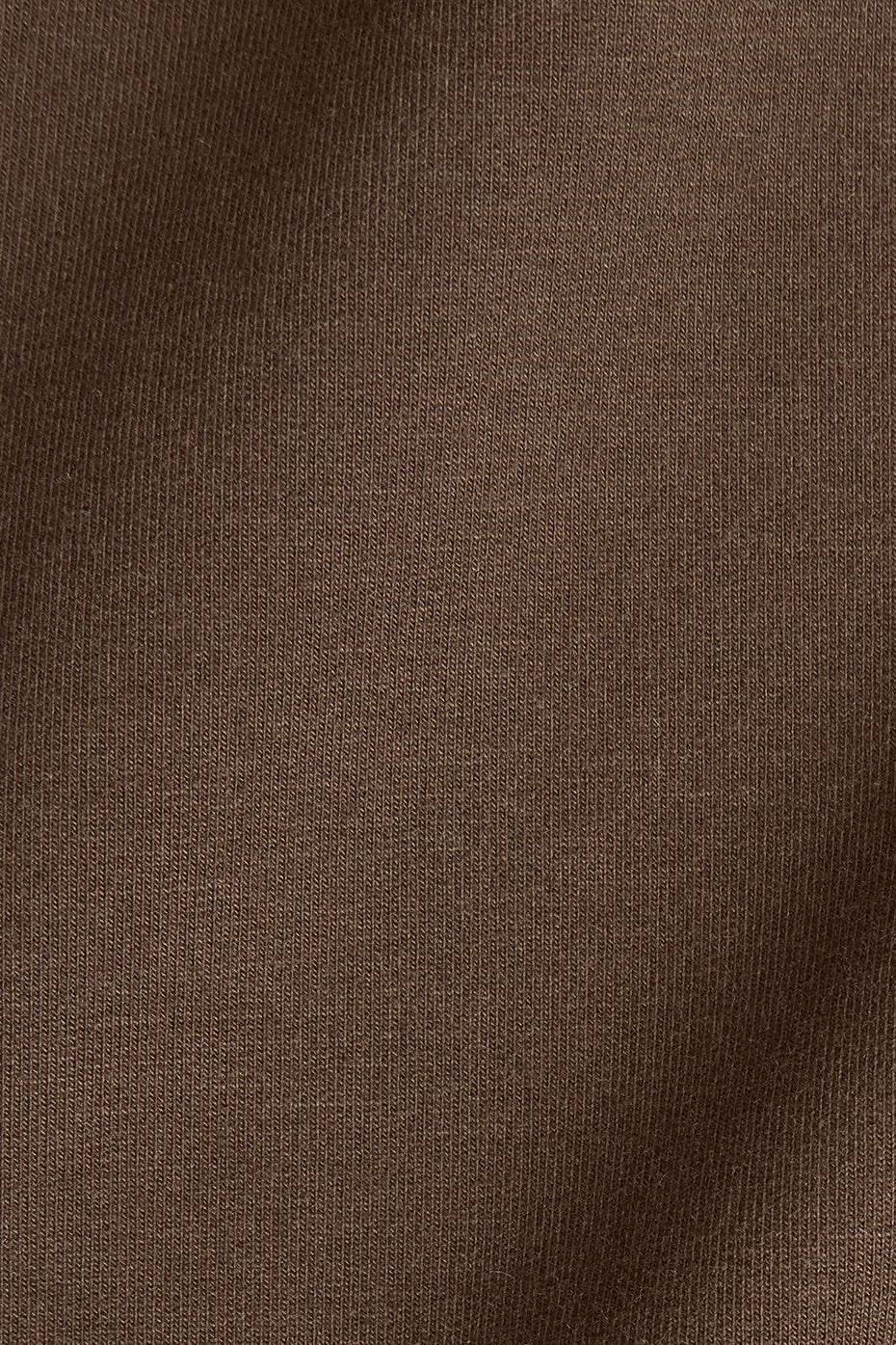 Side angle of the oversized t-shirt showcasing its extended sleeves.