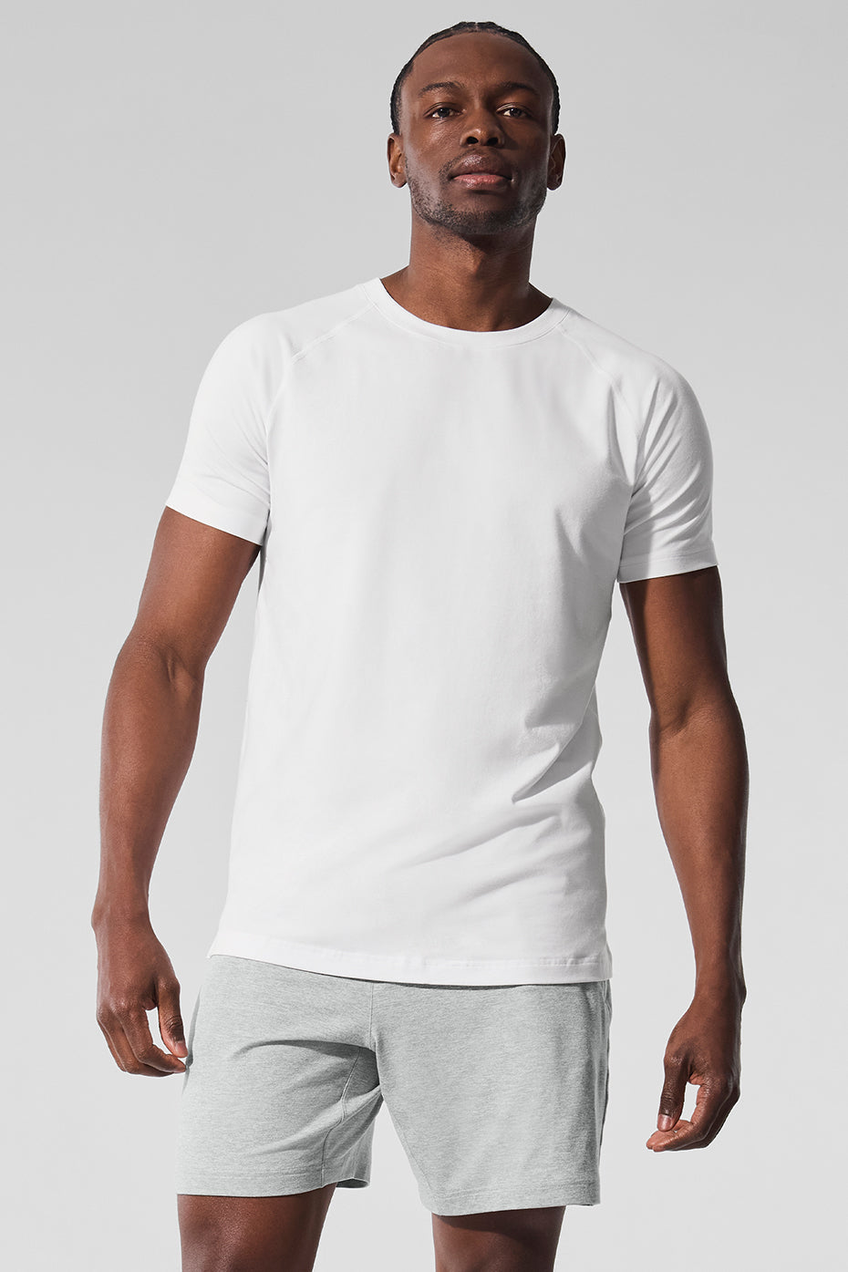 Front view of ALO Vapor Performance Crewneck Tee in white, showcasing its sleek design.