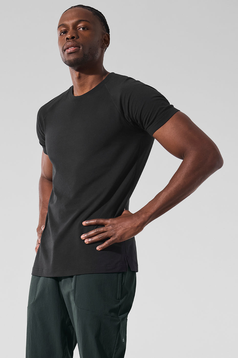 Front view of ALO Vapor Crewneck Tee in black, showcasing its sleek design.