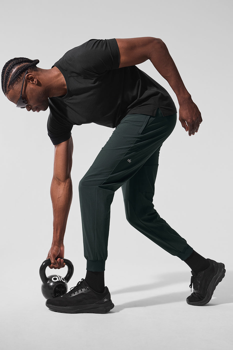 Side view of ALO Vapor Crewneck Tee, highlighting the fitted style for activewear.