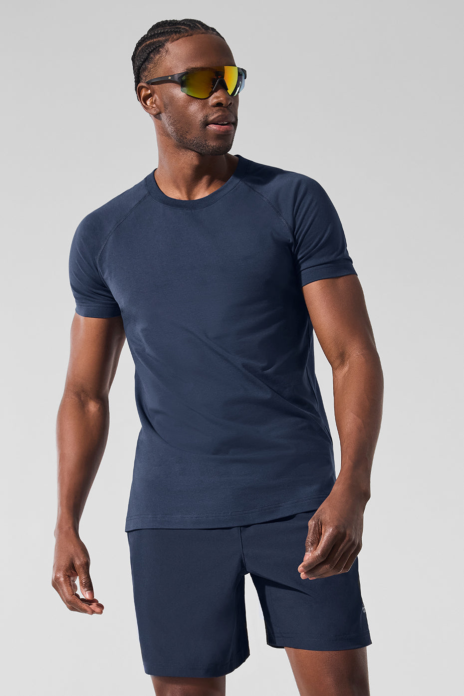 Front view of navy short sleeve fitness shirt worn during a cardio workout