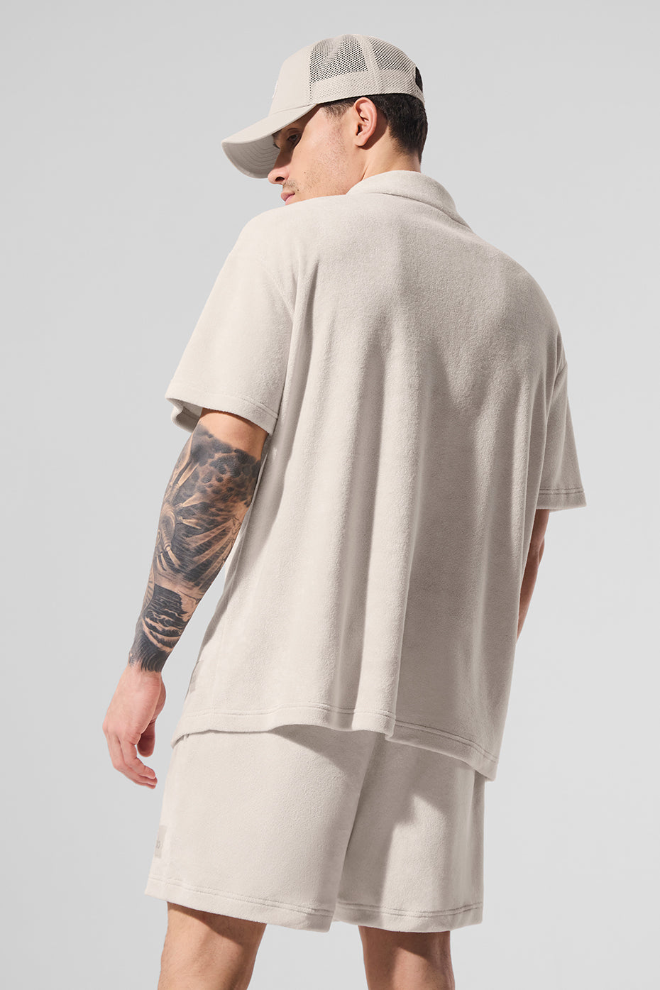 Close-up of camp collar and pocket on Coastal Terry Button-Up, showcasing cozy fabric.