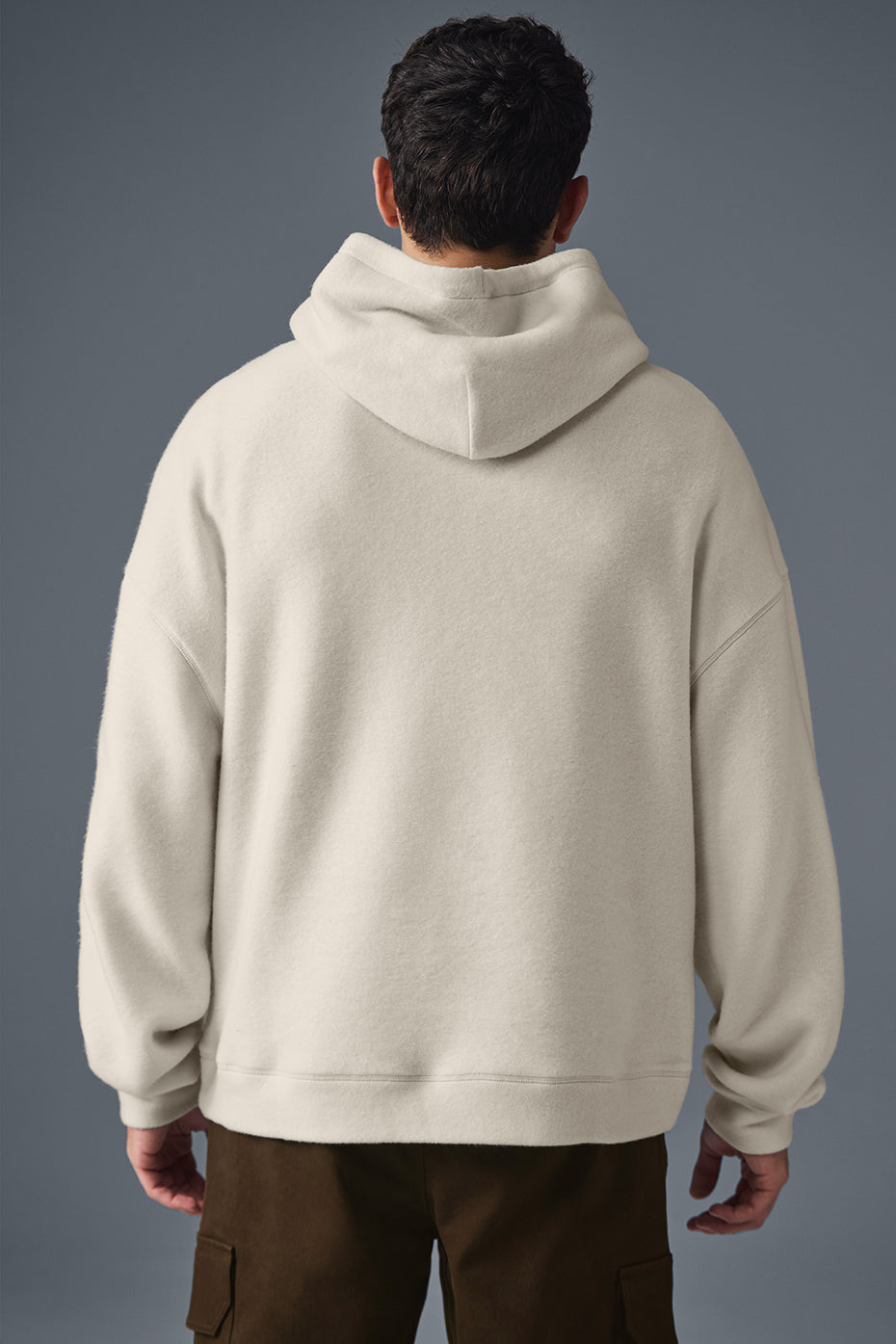 Model wearing the Triumph oversized zip-up hoodie, styled for a casual day out.