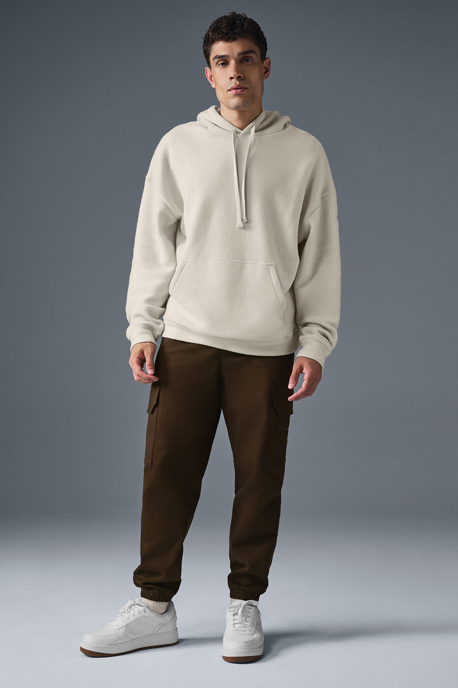Model wearing the Triumph oversized zip-up hoodie, styled for a casual day out.