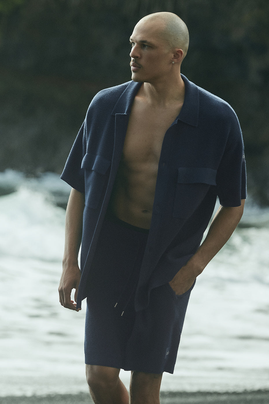 Close-up of black short sleeve button up texture highlighting waffle knit finish