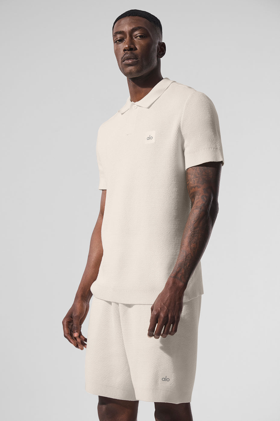 Front view of ivory polo shirt, ideal for golf and casual wear.