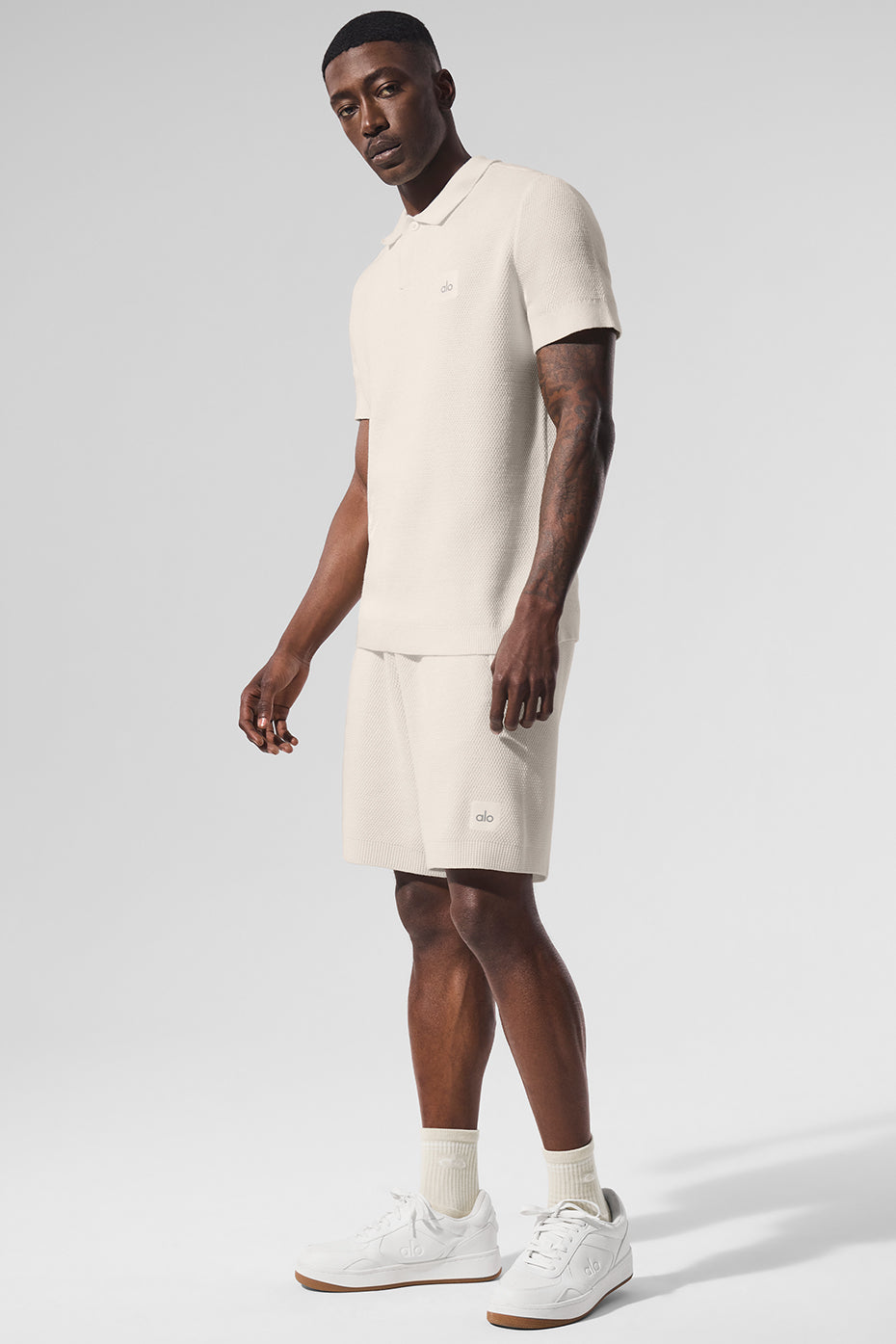 Front view of ivory polo shirt, ideal for golf and casual wear.