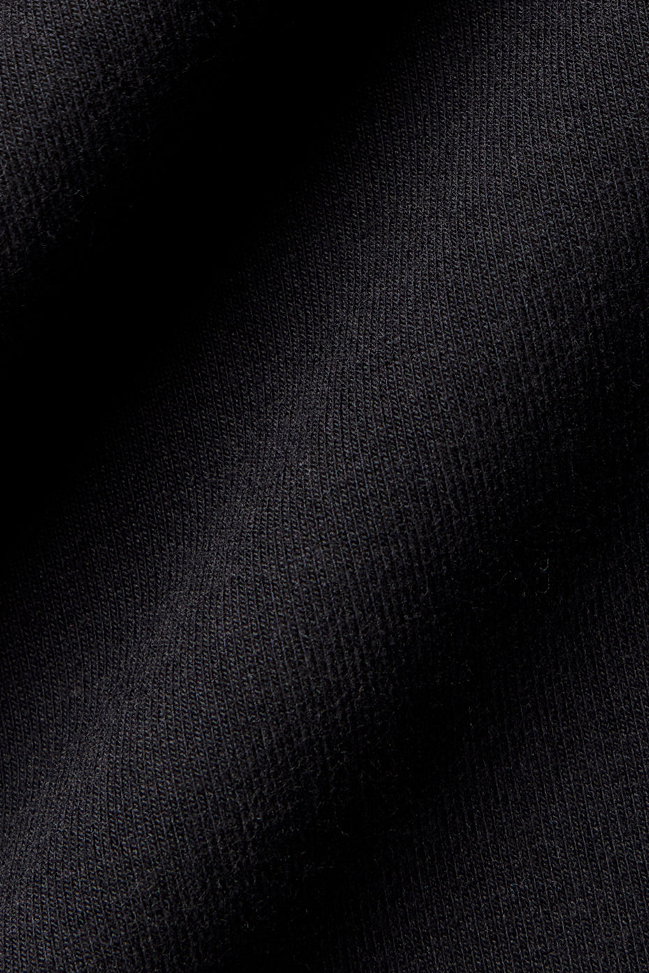 Casual look with black polo shirt paired with shorts.