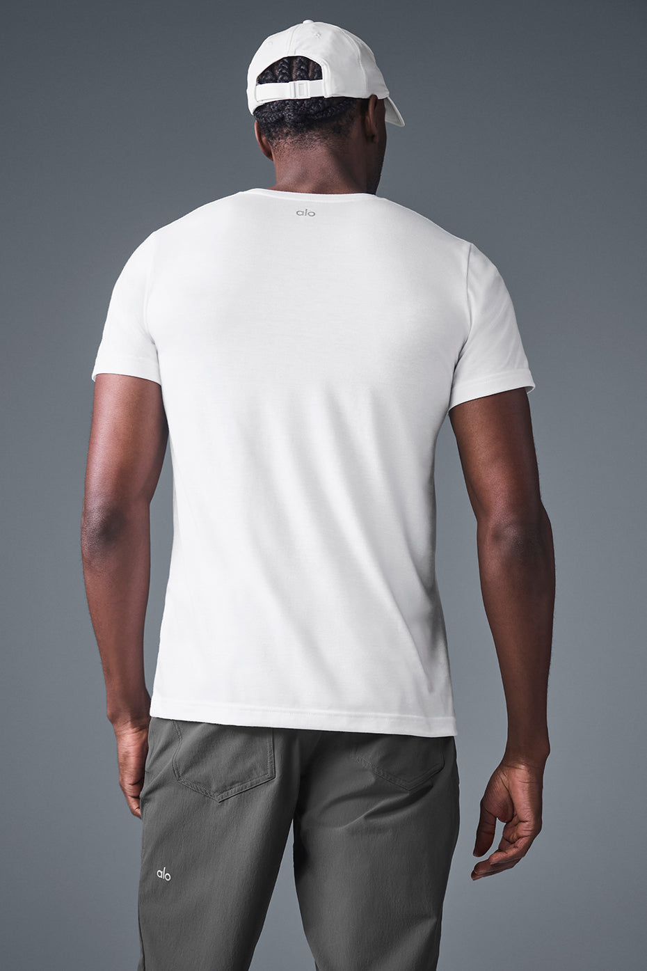 Man wearing the Timeless Triumph White T-Shirt during a workout.