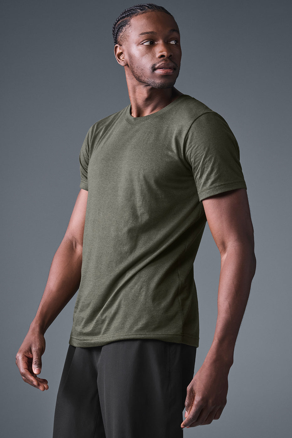Side view of stealth green training top during early morning jog in Phoenix