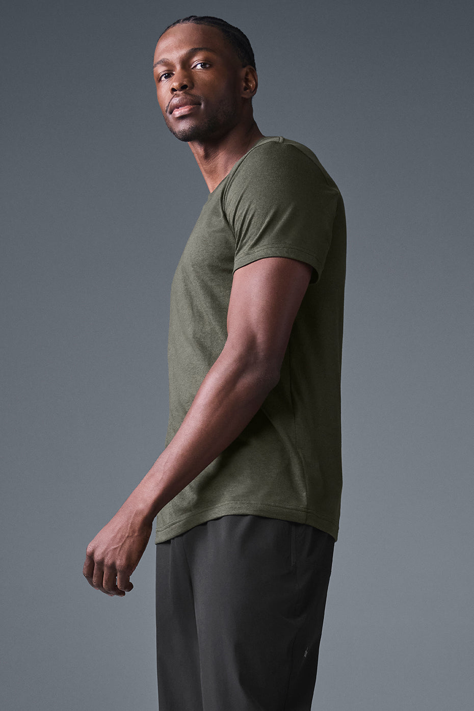 Side view of stealth green training top during early morning jog in Phoenix