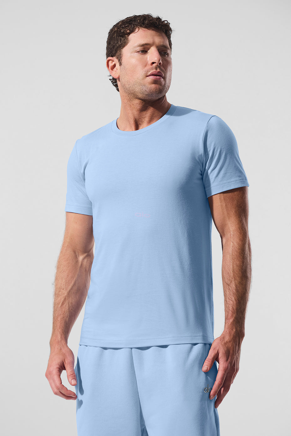 Front view of mens workout shirt in Seashell Blue worn during a gym circuit.