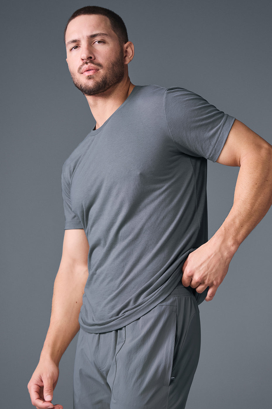 Casual style featuring the Triumph Performance Tee paired with workout shorts.