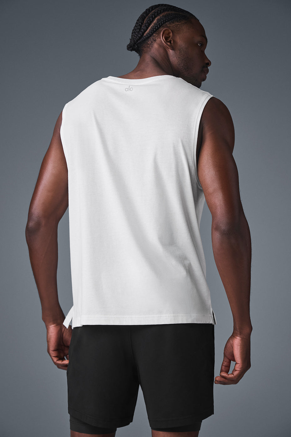 Side view of the ladies muscle tank showcasing its relaxed fit and dropped armholes.