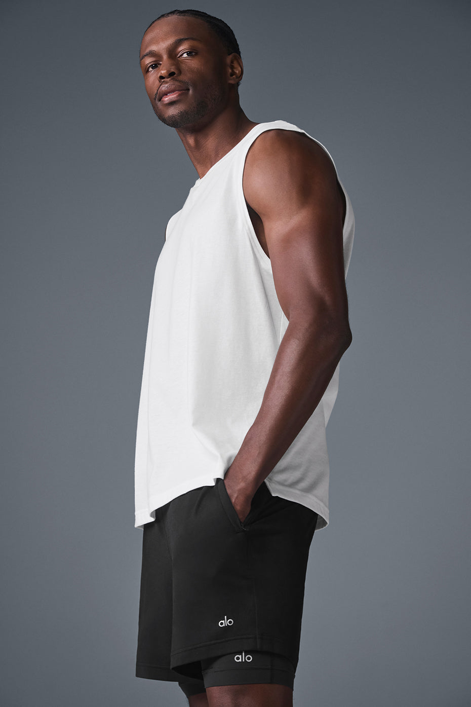 Model wearing the Triumph Muscle Tank during a casual outing, emphasizing versatility.