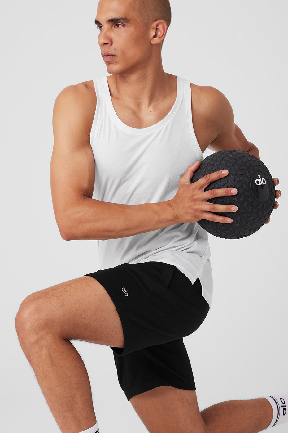 Side angle of performance tank showing dropped armholes and relaxed fit