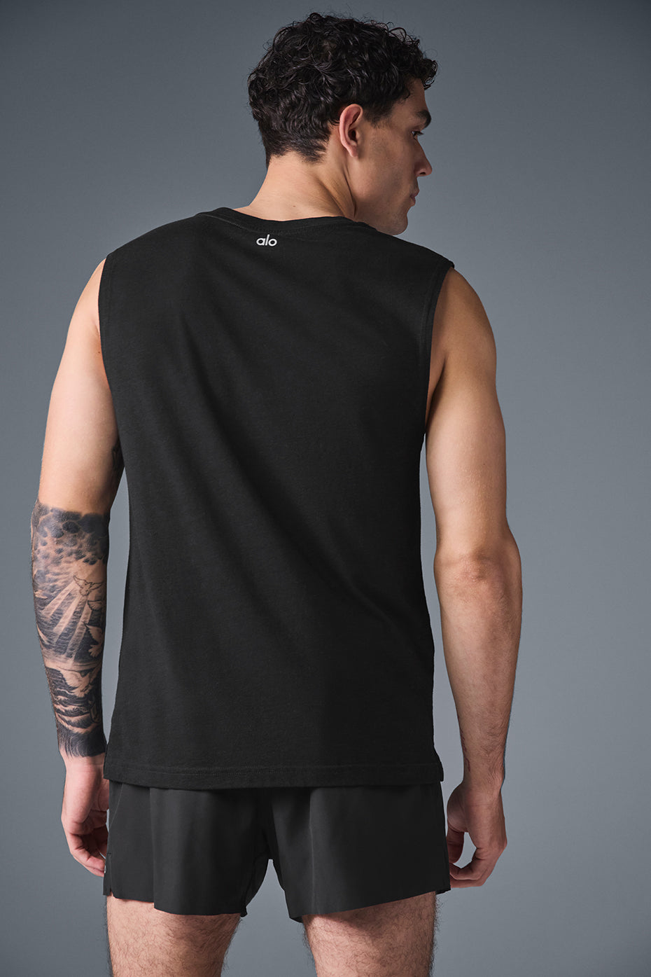 Close-up of the relaxed armhole design on the ladies muscle tank
