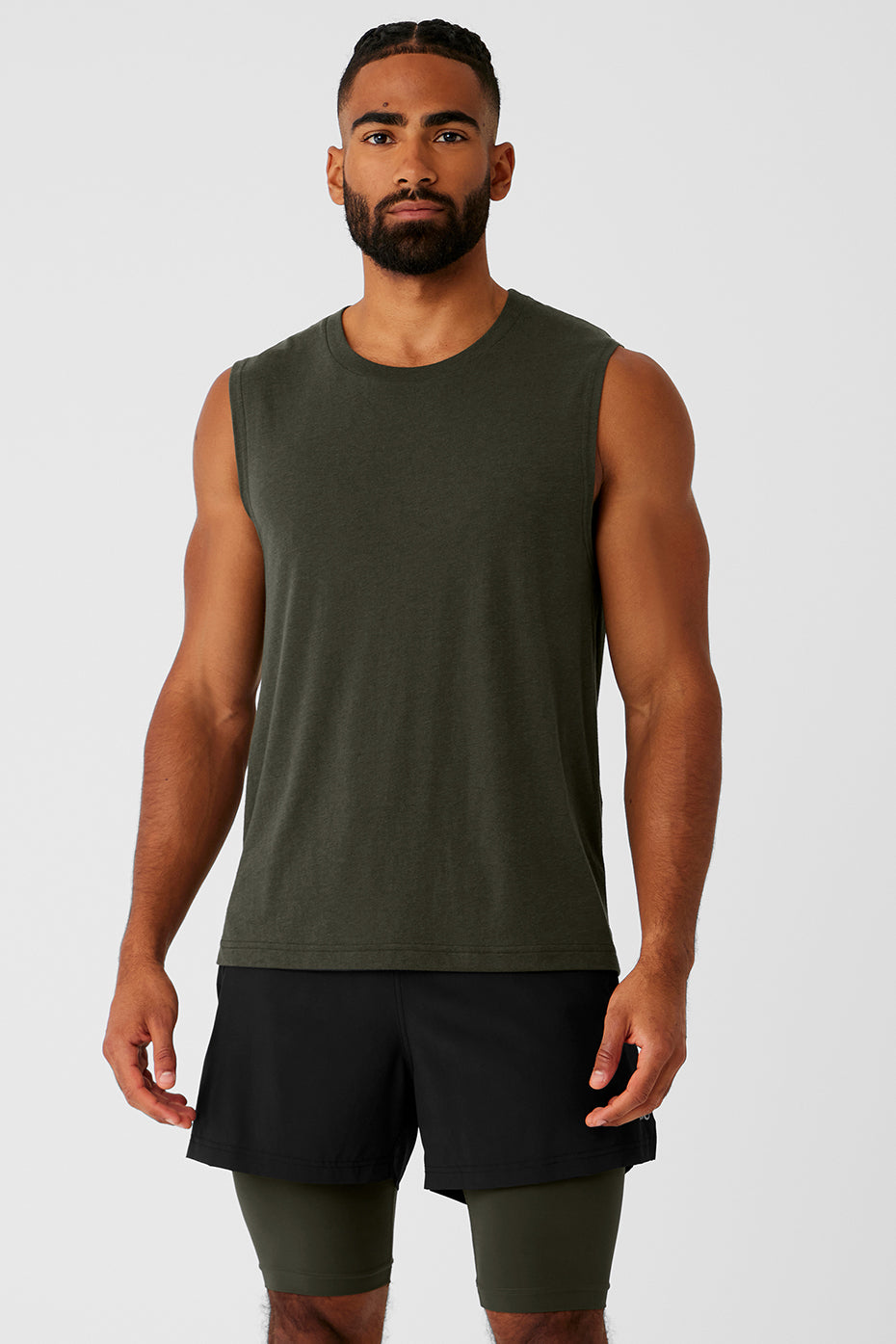 Front view of Triumph Performance Muscle Tank in Stealth Green, showcasing relaxed fit.