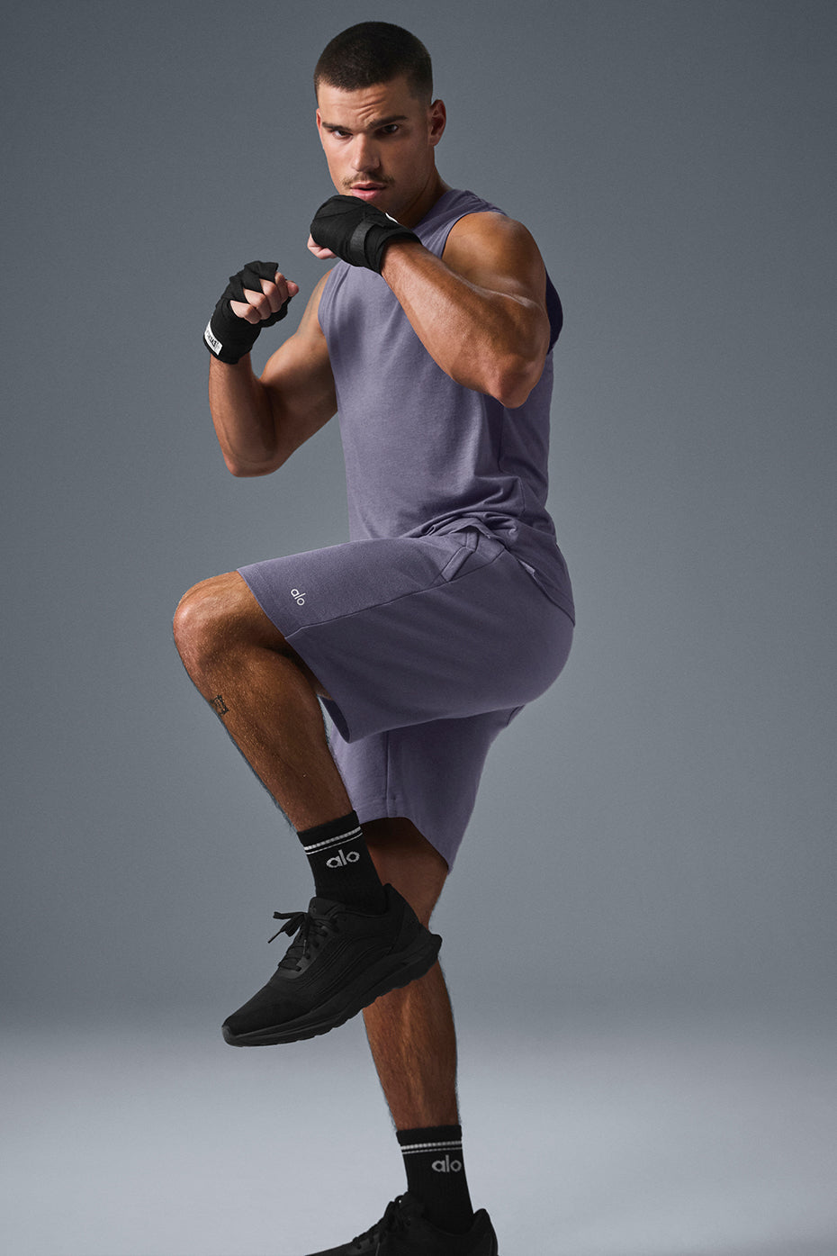 Front view of Triumph Muscle Tank in Italian Plum, showcasing relaxed fit.