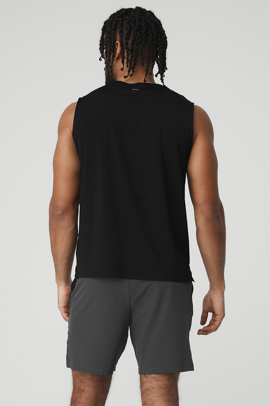 Model wearing the lightweight performance tank during a workout session