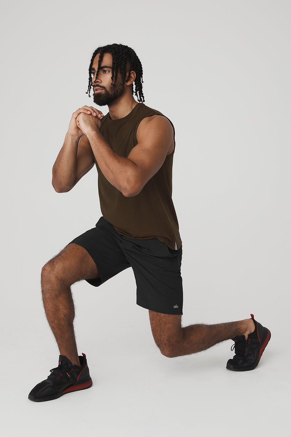 Front view of Idol Performance Tank in Espresso, showcasing its lightweight design.