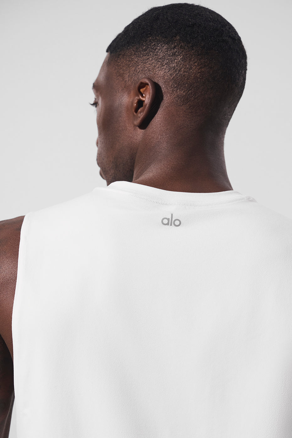 Back view of the Conquer Performance Muscle Tank, perfect for gym sessions.