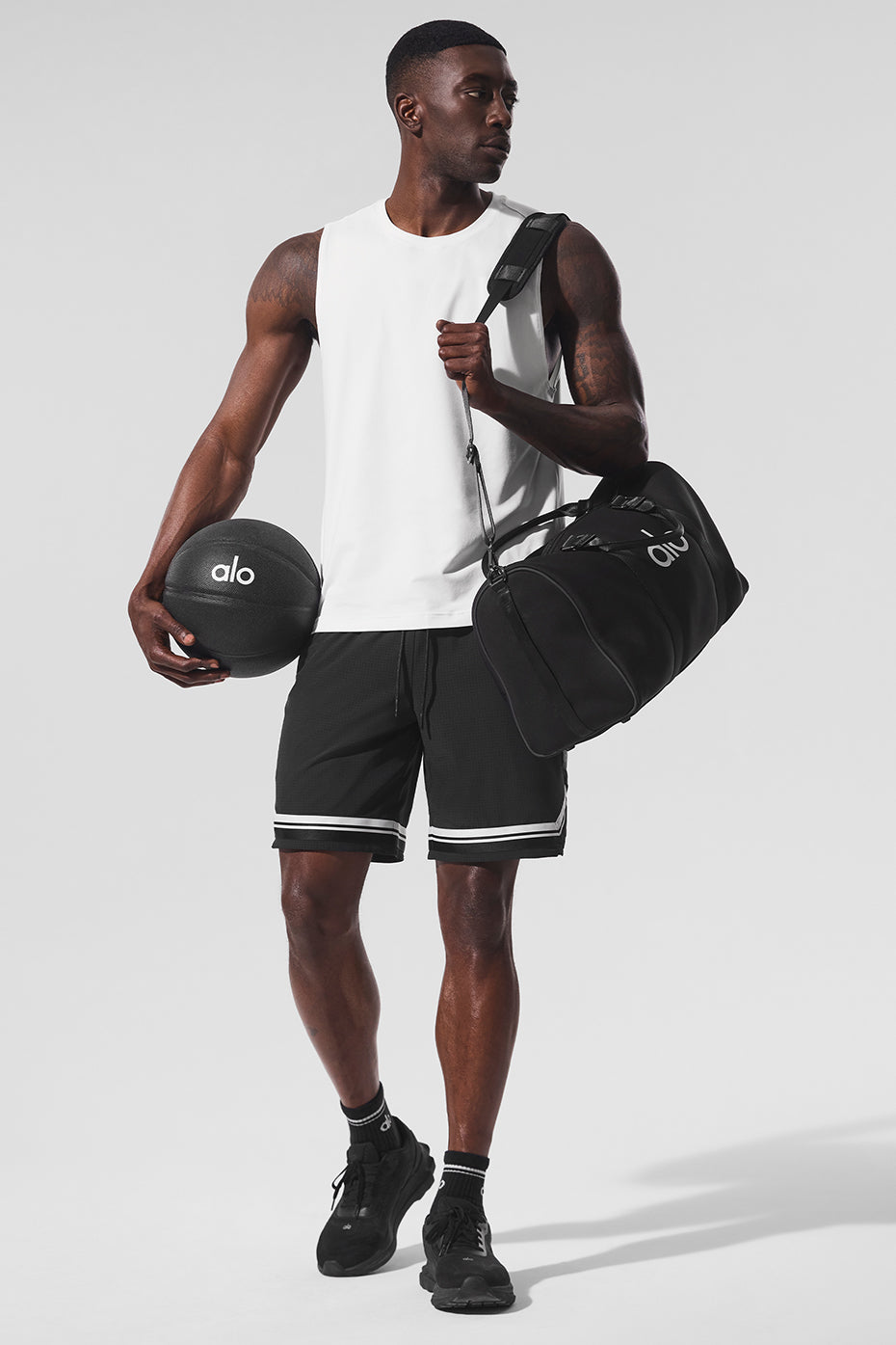 Front view of Conquer Performance Muscle Tank in white, showcasing its breathable fabric.