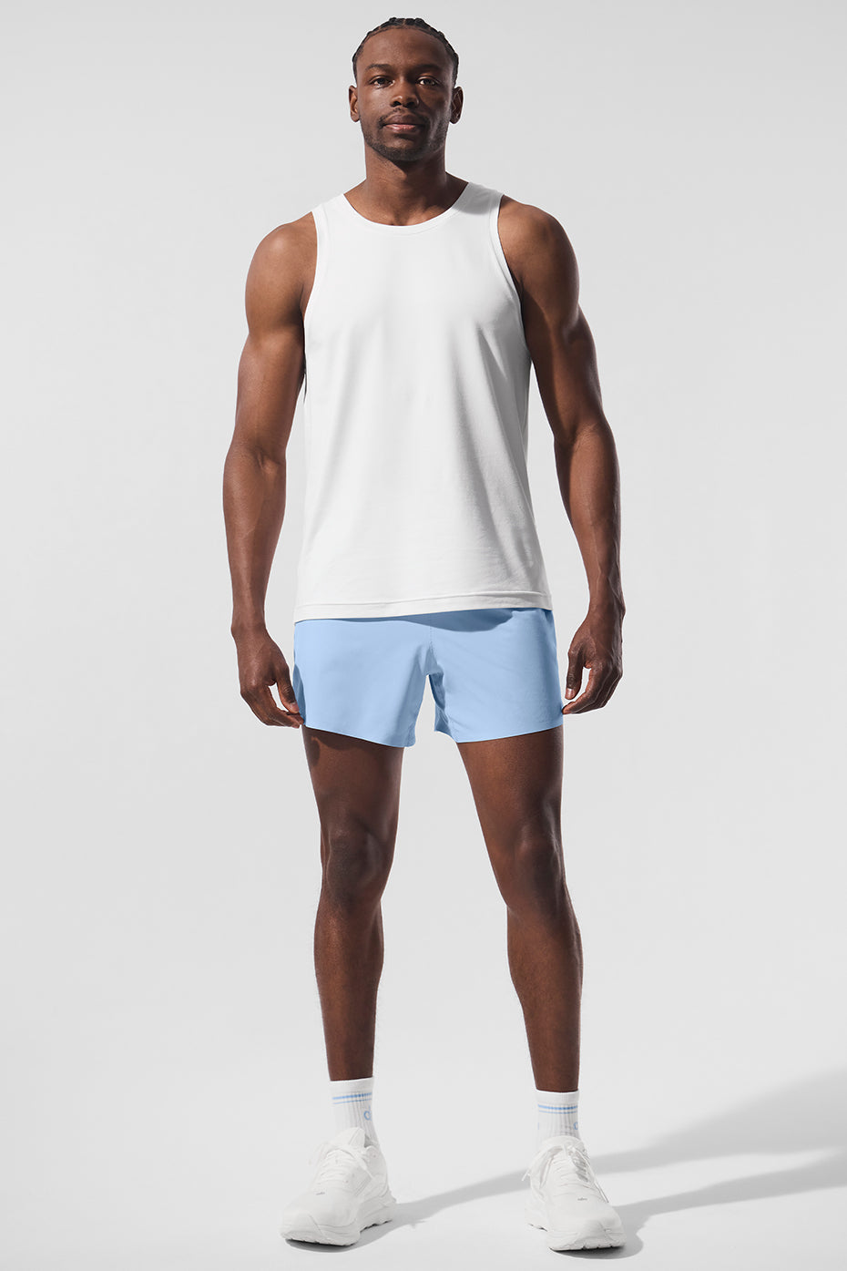 Front view of the Conquer Performance Tank in white, ideal for gym sessions.