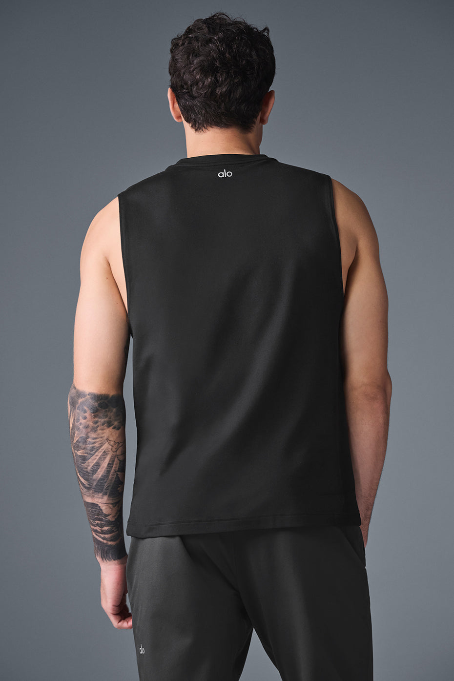 Ladies muscle tanks layered under hoodie for comfortable post-workout style