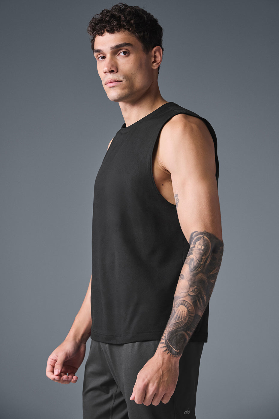 Black muscle tank shown with matching shorts, great gym wear for high-intensity training