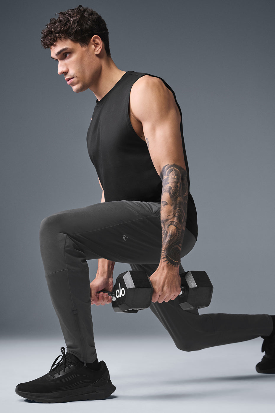 Black muscle tank shown with matching shorts, great gym wear for high-intensity training