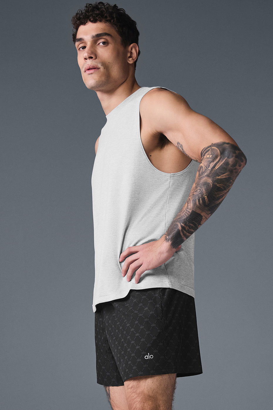 Layered outfit with muscle tank and hoodie for post-gym style