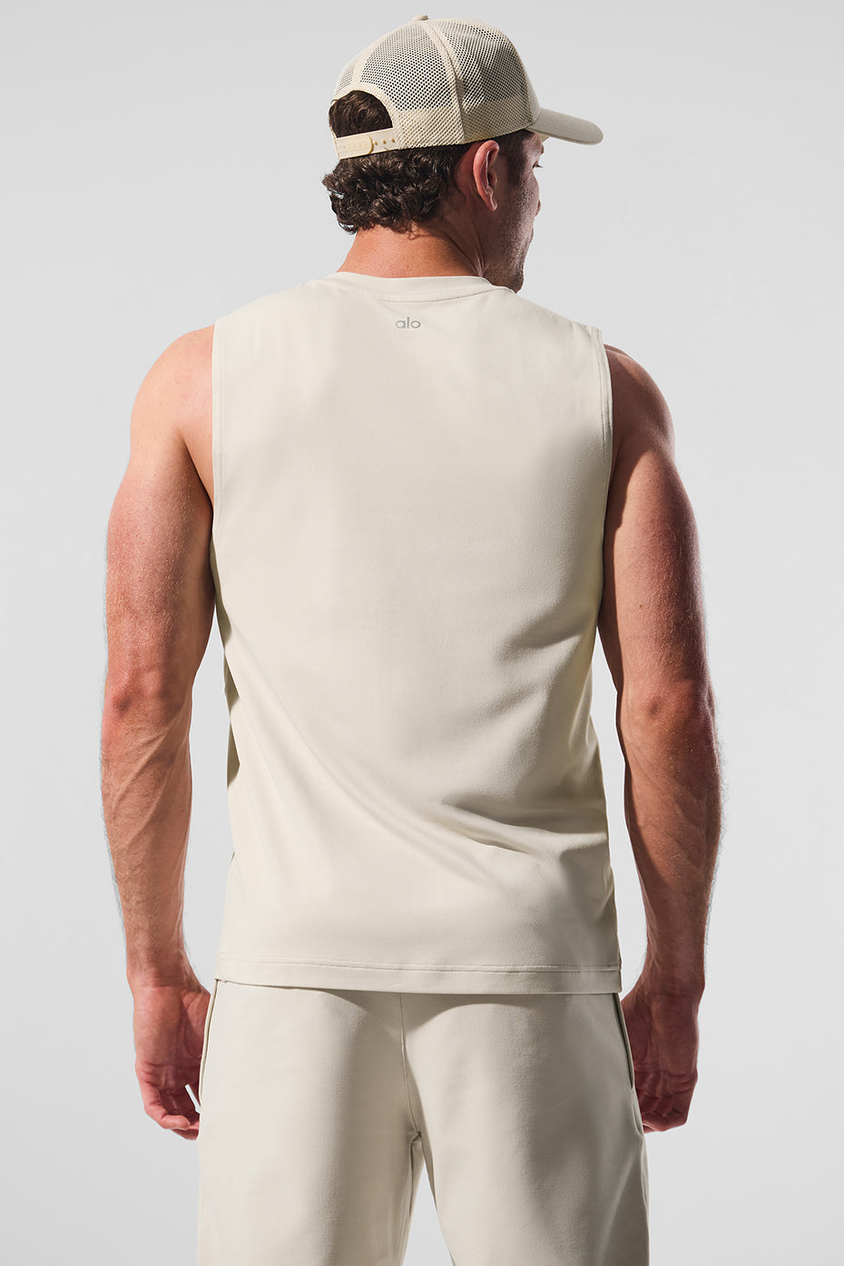 Back view of Conquer muscle tank, highlighting breathable fabric.