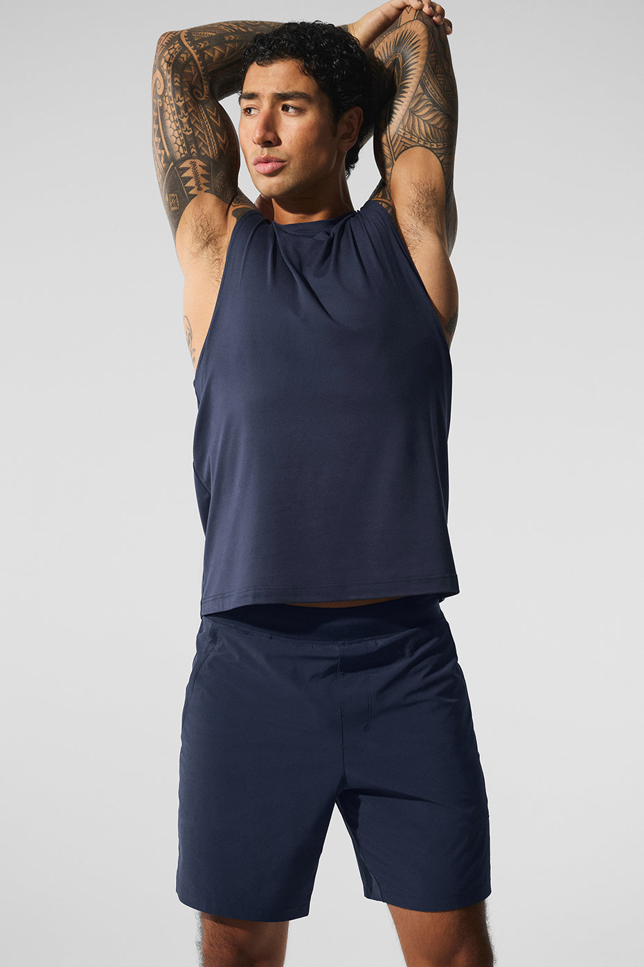 Front view of navy blue muscle tank top for women