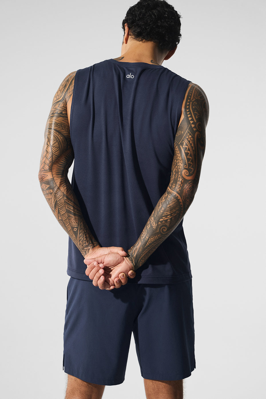 Side view showcasing the wide armholes of the fitness tank top