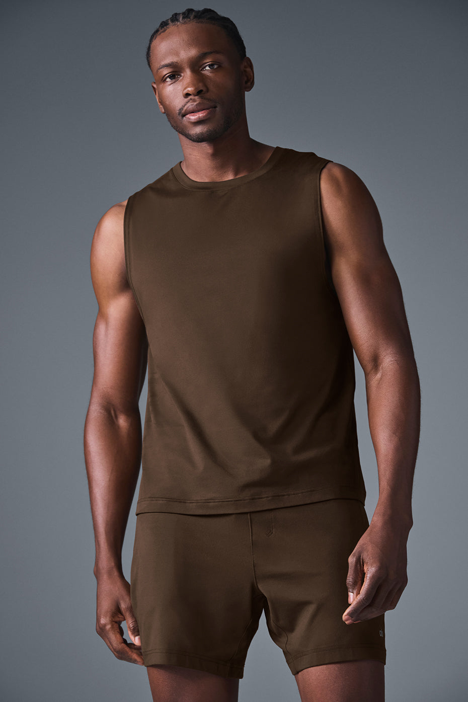 Front view of Conquer Muscle Tank in Espresso highlighting crew neck and wide armholes