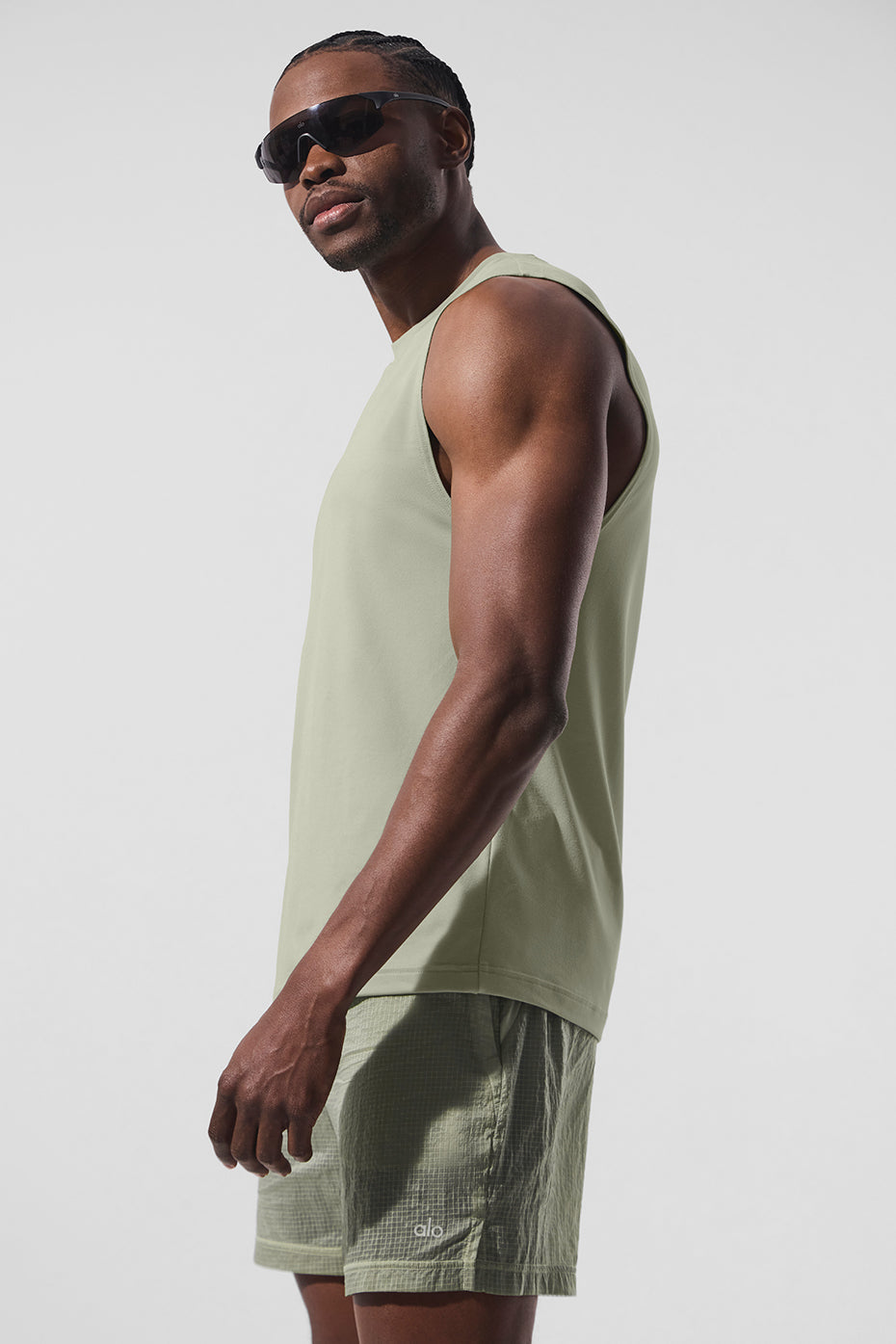 Front view of the Elevate Performance Muscle Tank in limestone, ideal for gym wear.