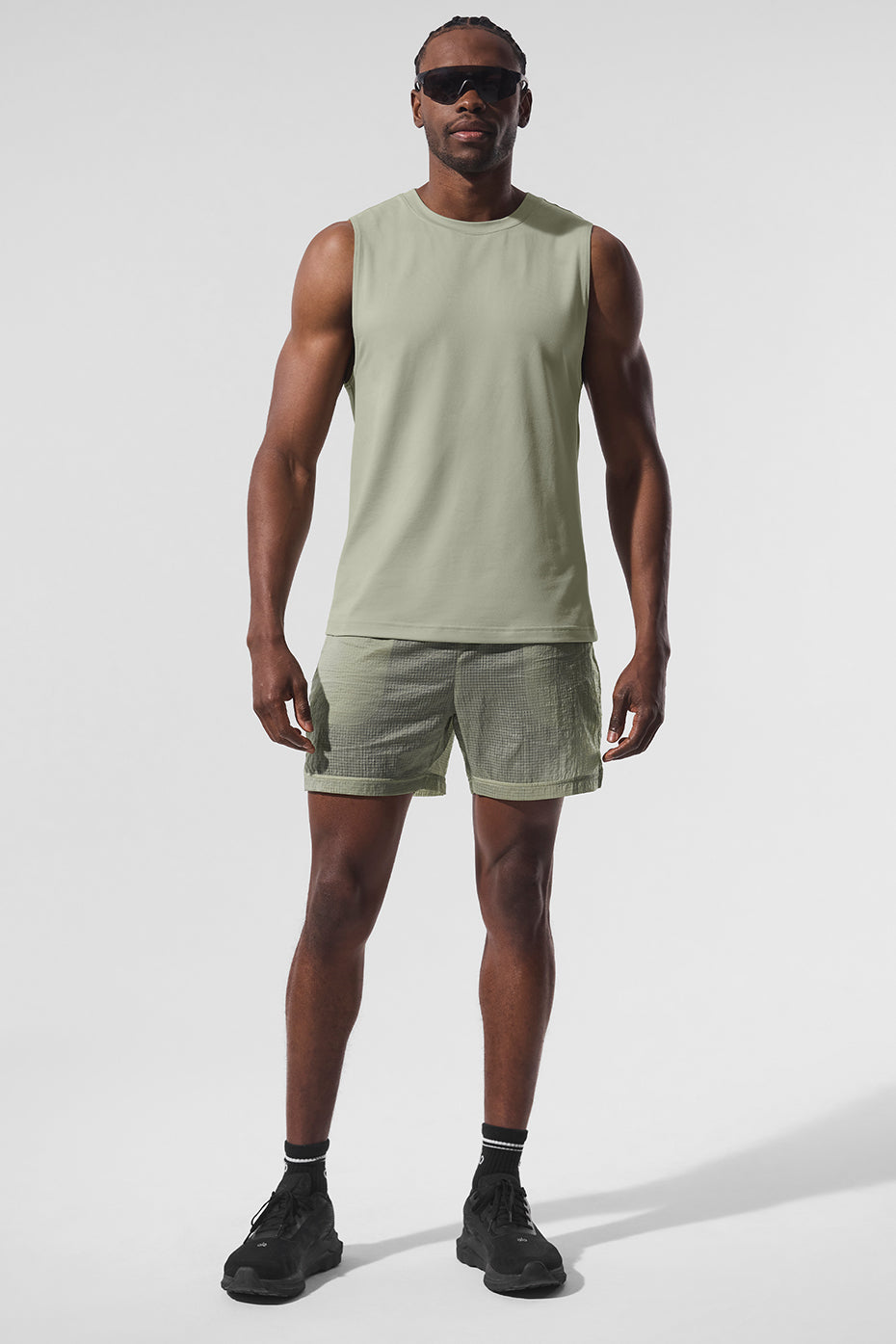 Front view of the Elevate Performance Muscle Tank in limestone, ideal for gym wear.